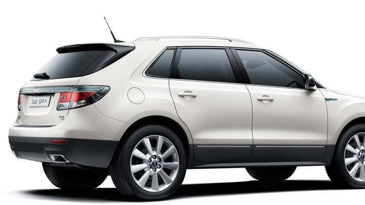 Side Pose Of 2011 Saab 9-4X On White Background